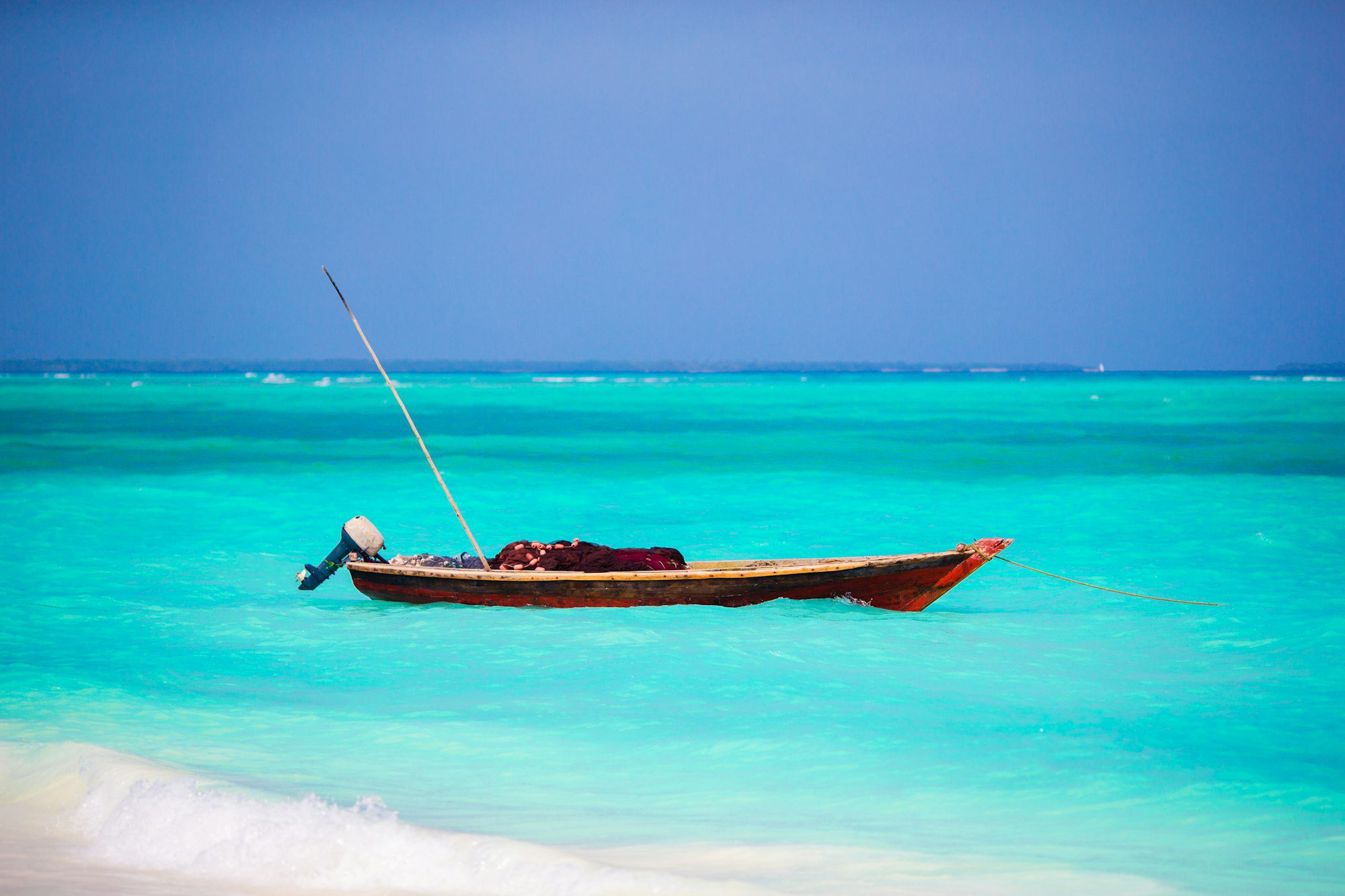 Old wooden dhow in the Indian Ocean near Zanzibar